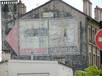  anciennes publicités peintes sur un mur d'immeuble